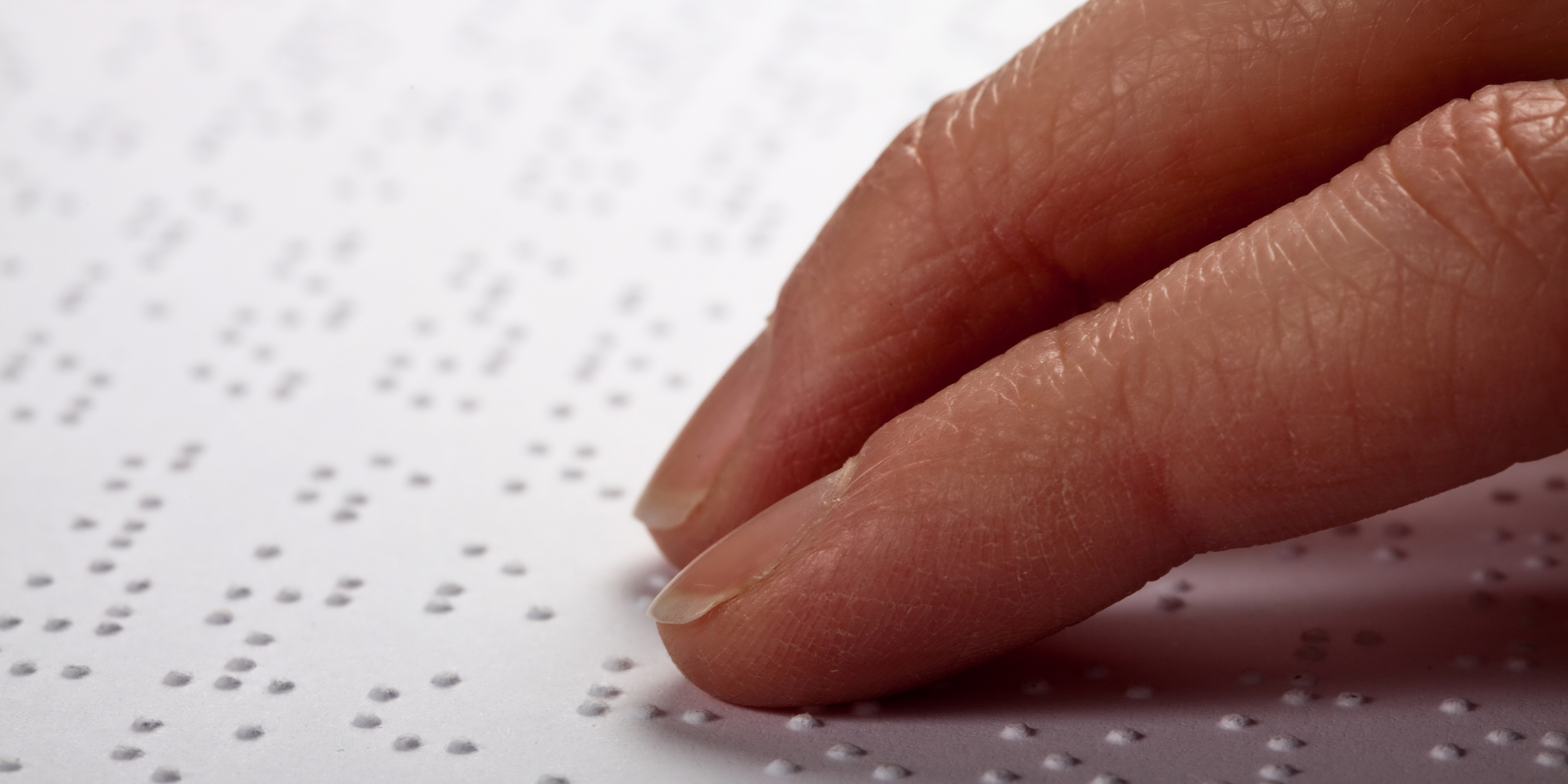 Braille hands used as banner with page title on it (Alternative & Accessible Formats)